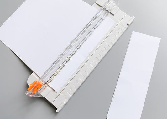 Paper cutter for scrapbook papers and other craft projects